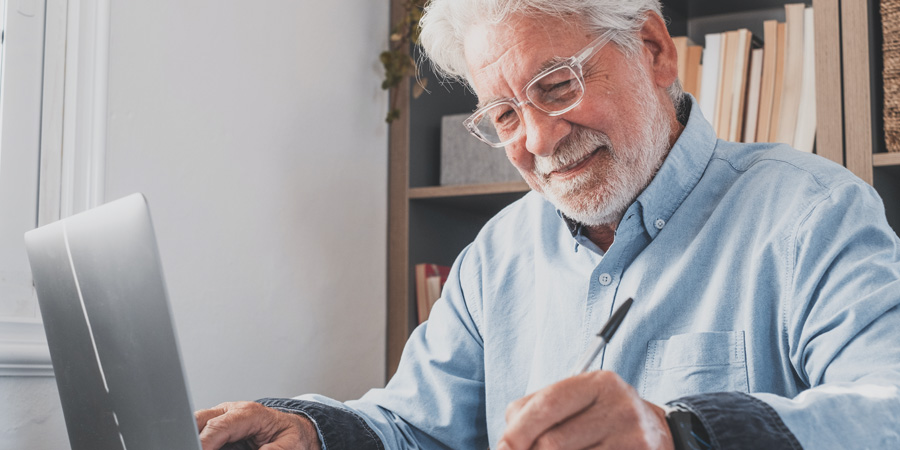 man looking at laptop computer