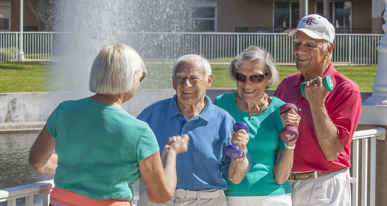 residents lifting weights outside