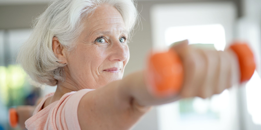 woman exercising with dumbbell