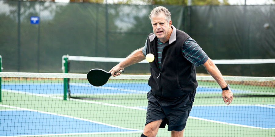 man playing pickleball